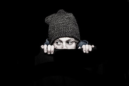 peeping man in gray knit hat