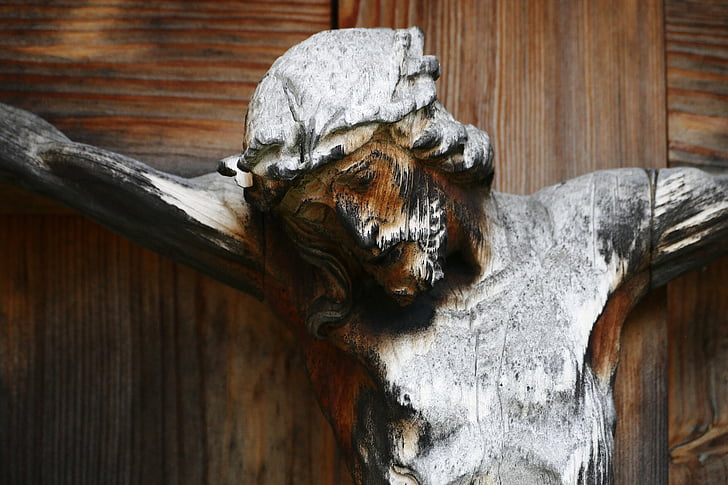 Jesus Christ nailed to the cross wooden statue