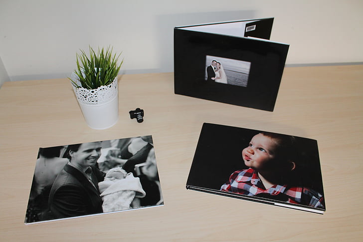 grayscale photos on table