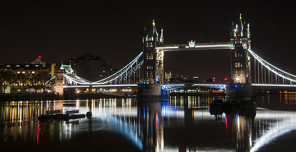 lighted tower bridge at night time