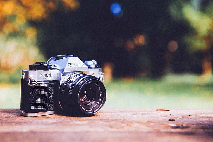 selective focus photography of black and gray Canon AE-1 DSLR camera