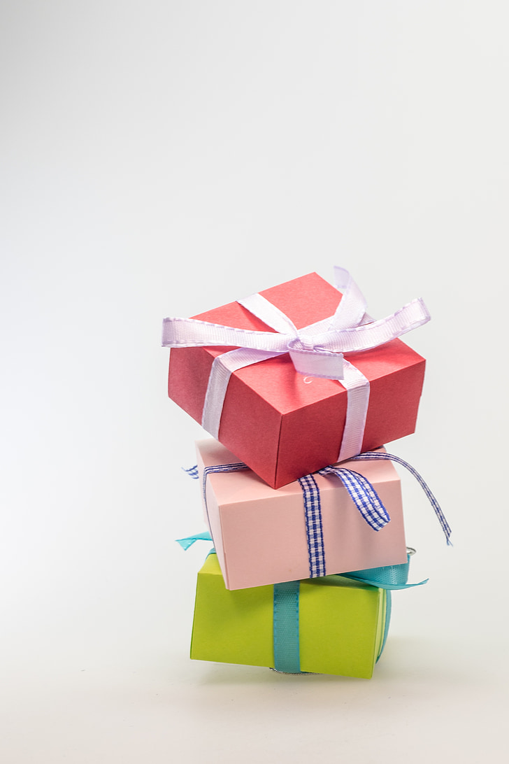 three assorted-color gift boxes