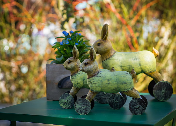 three rabbit figurines