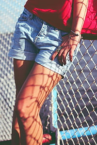 closeup photo of woman wearing blue denim short shorts