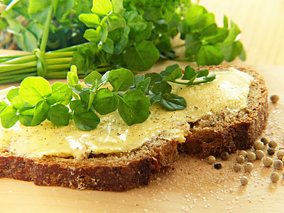 green vegetable on top of sliced bread with butter