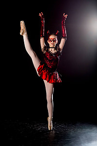 woman wearing red ballerina devil dress