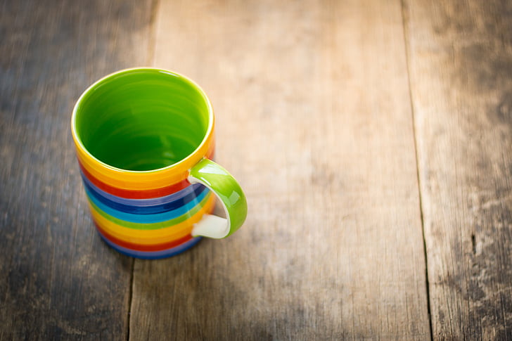 multicolored ceramic mug