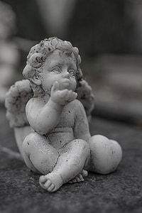 cherib ceramic figurine in macro photography