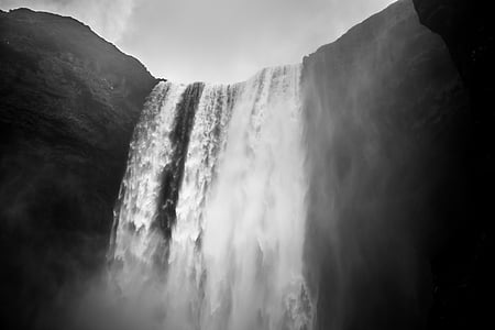 grayscale low-angle photography of waterfall