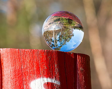 selective focus photography of glass ball
