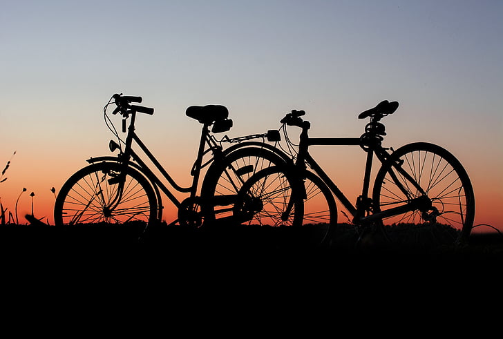 silhouette of two bicycles