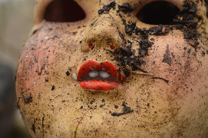 close up photography of doll with muds