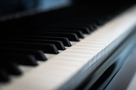 selective focus photography of black piano