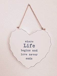 heart-shaped white and black where life begins and love never ends decorative board