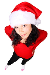black haired woman in red long-sleeved top and wearing santa hat