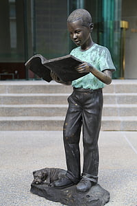 boy reading book statue