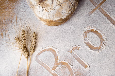 wheat stalks on table with flour