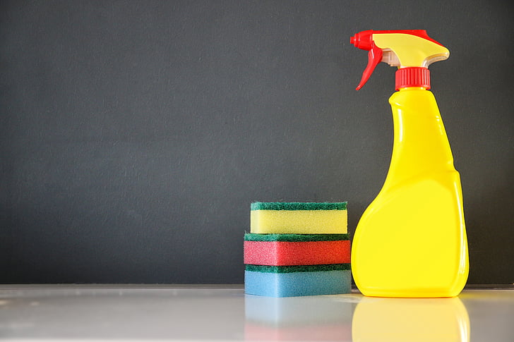 yellow and red spray bottle
