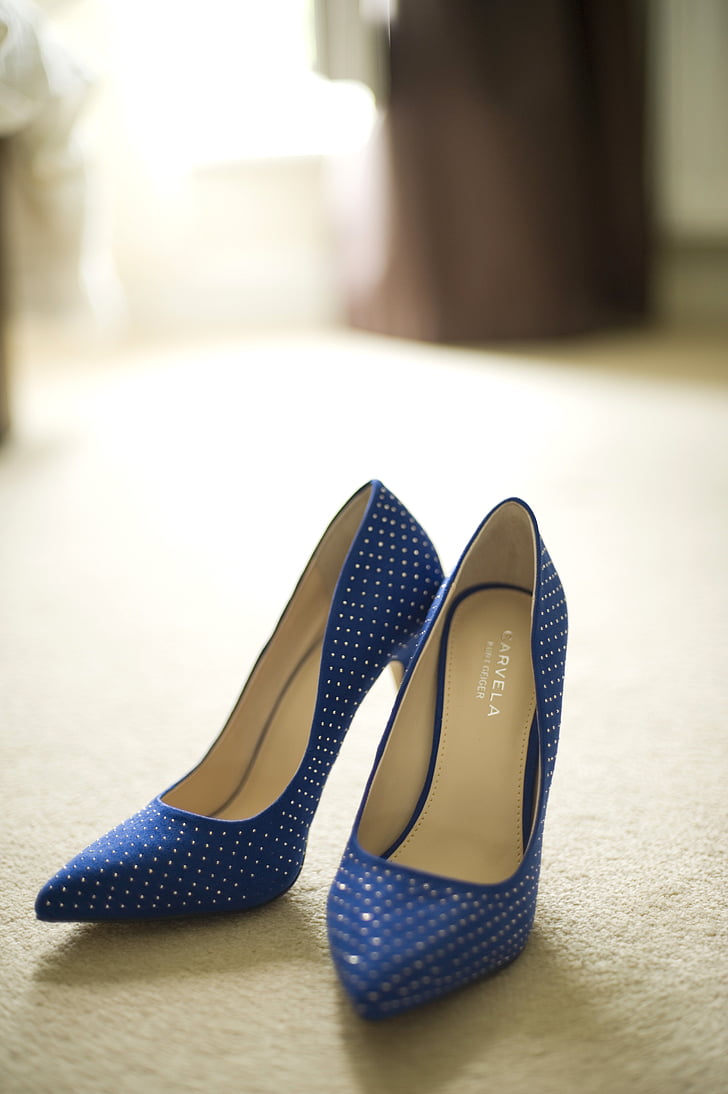 pair of women's blue-and-white stilettos