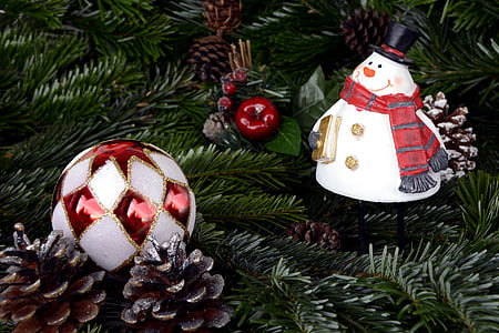 two white-and-red Christmas bauble near snowman ornaments