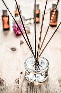 clear glass container and incense sticks