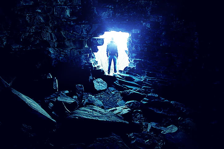 man outside cave