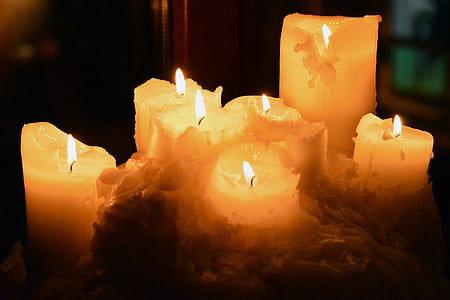 lighted white pillar candles