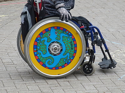 person sitting self-propelled wheelchair