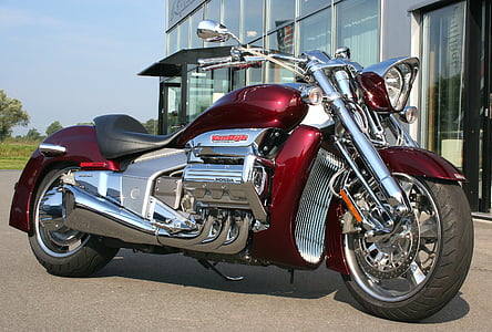 red, gray, and black cruiser motorcycle