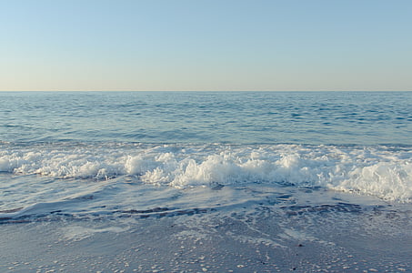 photograph of waves on calm sea