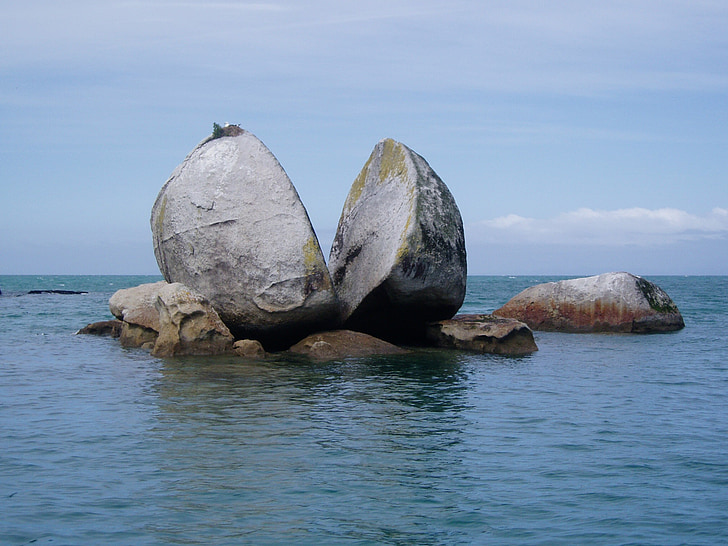 two big rocks surrounded by water
