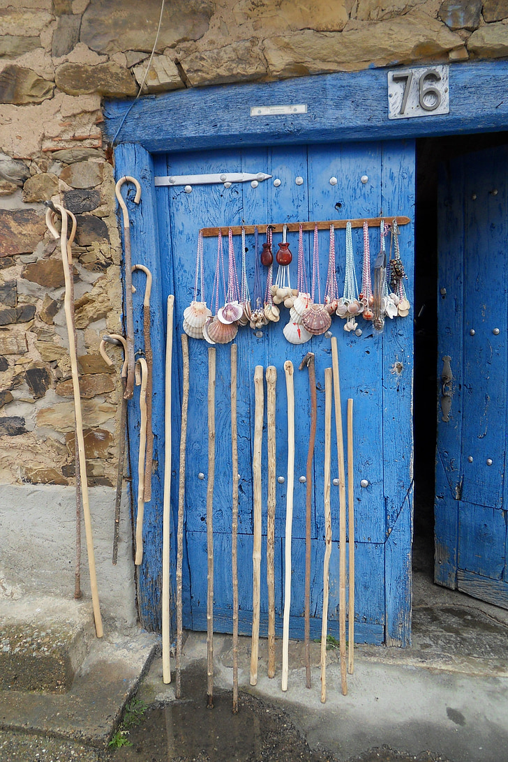 hand canes leaned on blue door
