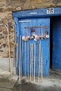 hand canes leaned on blue door