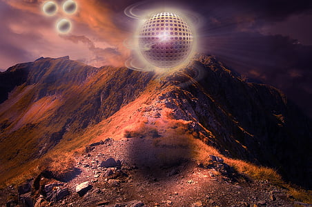 gray sphere floating on mountain top art