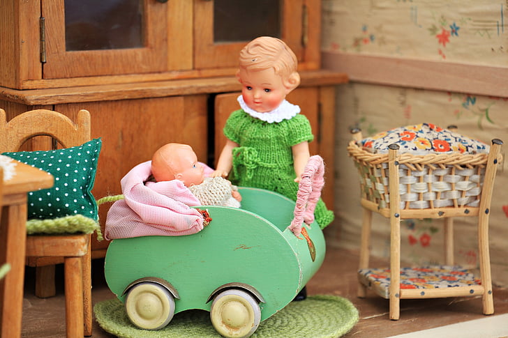girl and baby doll photograph
