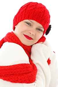 woman in white knit long-sleeved shirt with red knit cap and scarf