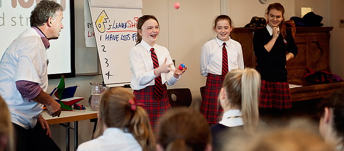 girl in school uniform performing in class at daytime