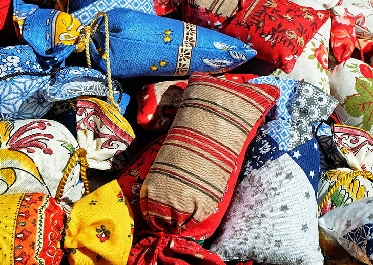 close up photography of assorted-color throw pillows