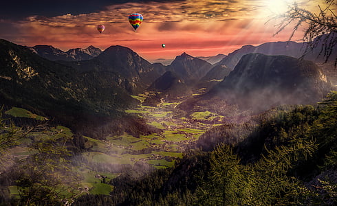 hot air balloons above the mountain