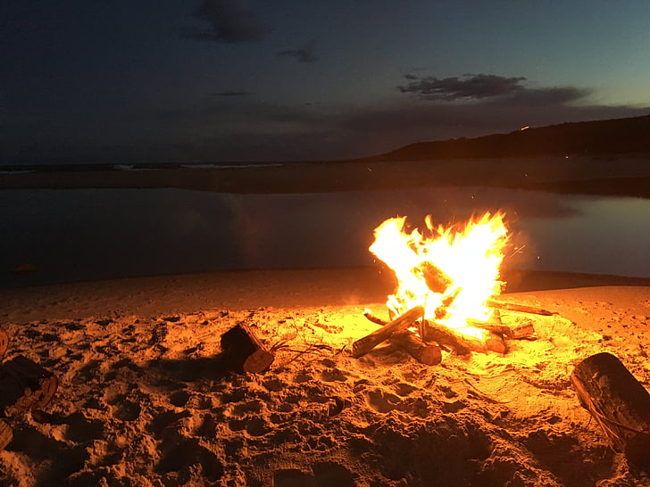 bonfire beside seashore
