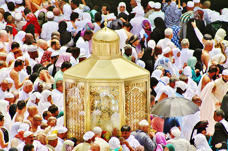 people gathering beside gold altar