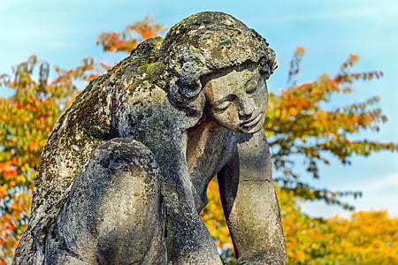 woman statue near trees