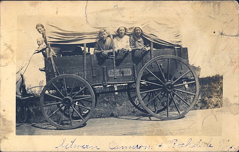 group of people riding carriage photograph
