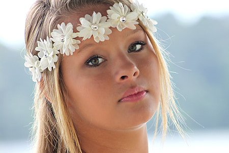 woman wearing white floral crown