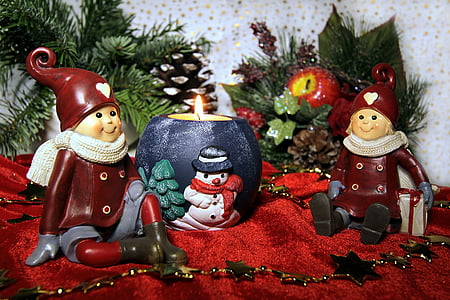 Christmas-themed decorations on red velvet surfacew