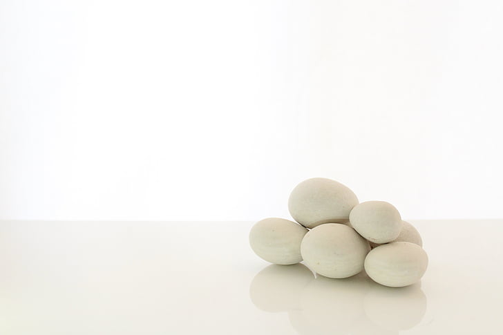 pile of white stones with white background