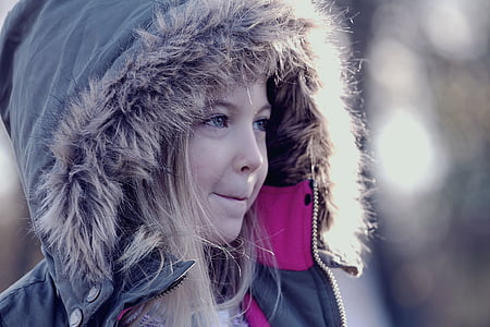 girl wearing grey and brown fur-lined hooded jacket closeup photography