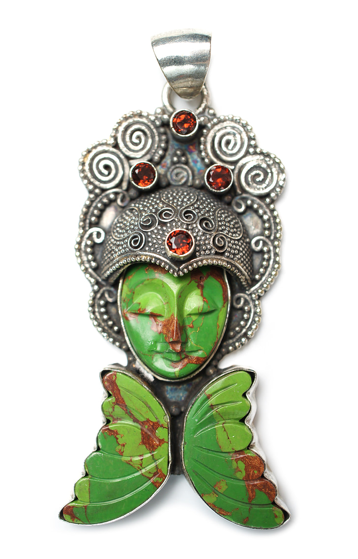 green and silver-colored Buddha pendant