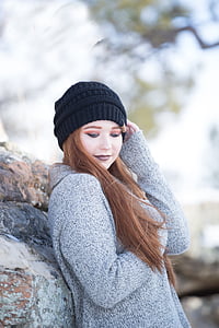 woman wearing gray sweater with black knit cap in focus photography