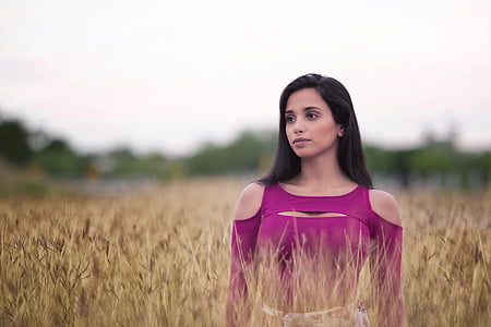woman wearing purple cold-shoulder top in wheat field